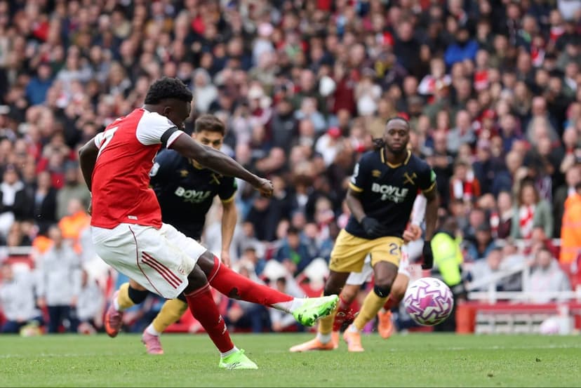 Saka Reaches Milestone as Arsenal Cement Top Spot in Thrilling Victory