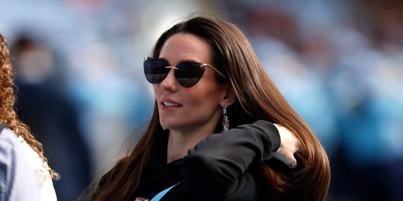 Coach Supports Quarterback's Girlfriend on Field