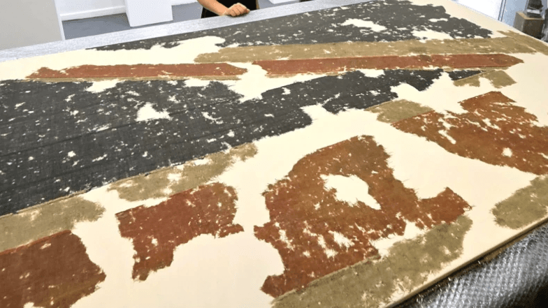 Sunken Royal Navy Warship's Flag Restored After 155 Years