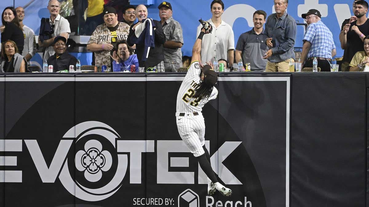 Padres Outfielder Scales Wall to Steal Home Run, Fans Stunned