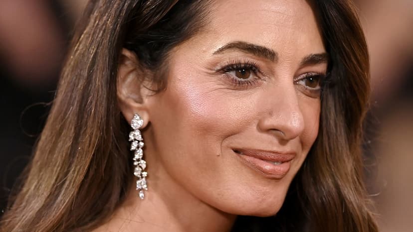 Amal Clooney Stuns in Flared Jeans at Airport