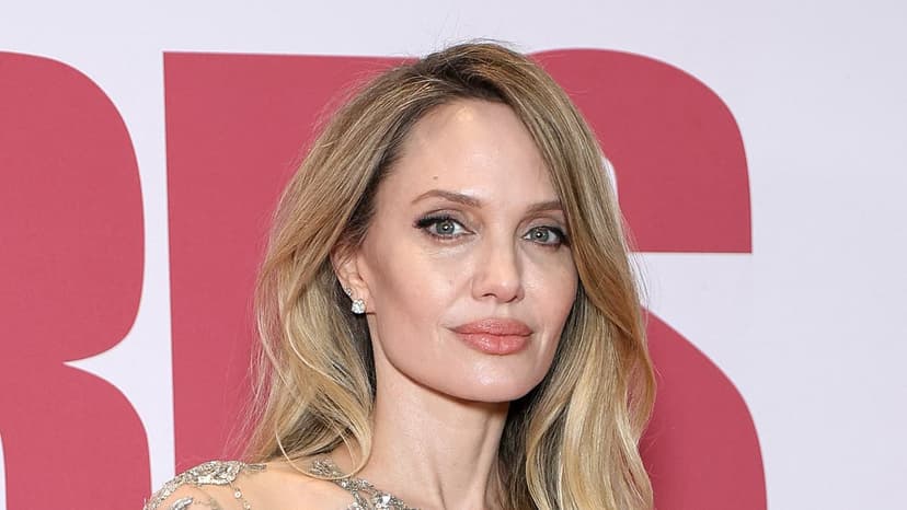 Jolie Stuns in Bejewelled Gown at Paris Premiere