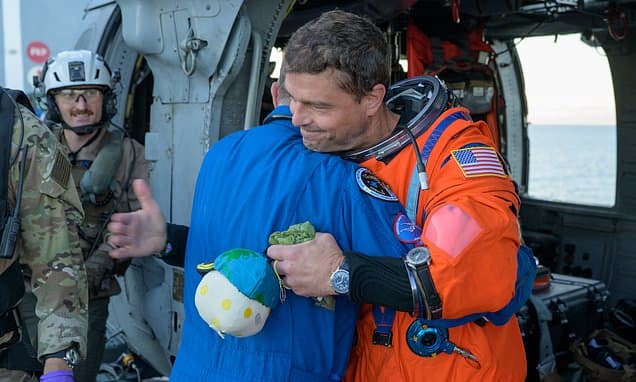 Commander Swipes Mascot Before Splashdown