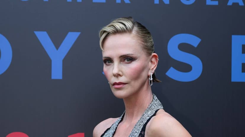 Charlize Theron Dazzles in Dramatic Lace Gown