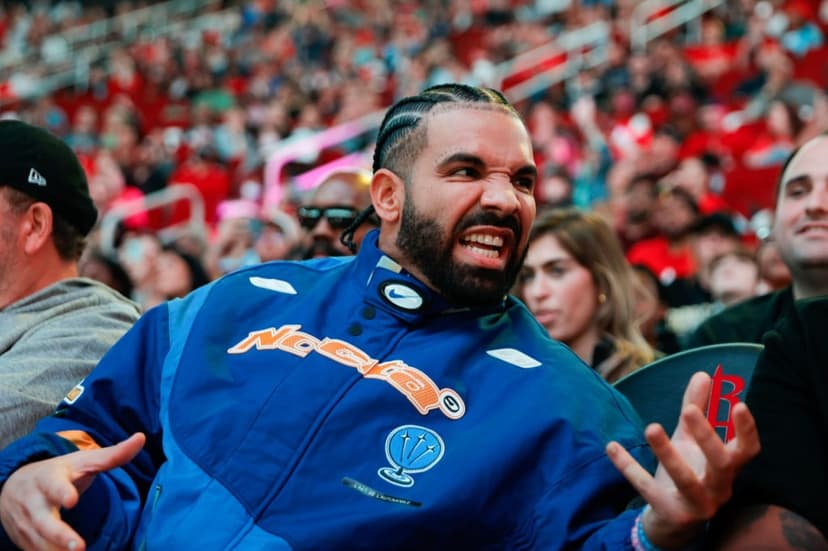 Drake Flaunts New Cash Money Chain, Mocks Pharrell