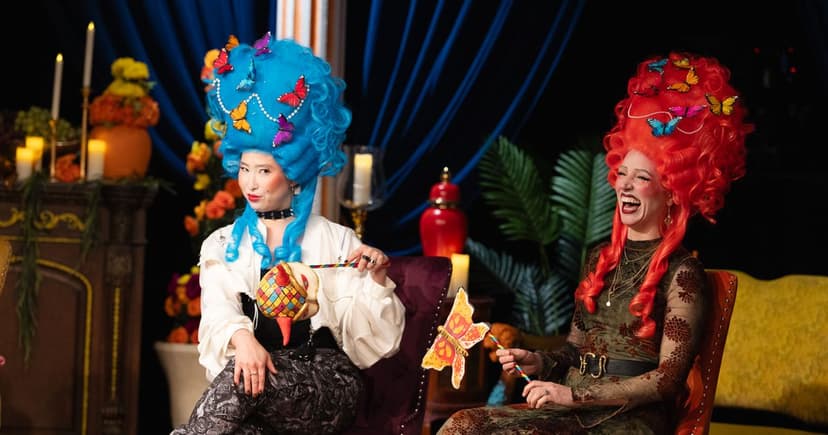 Wigged contestants fool each other in hidden role game