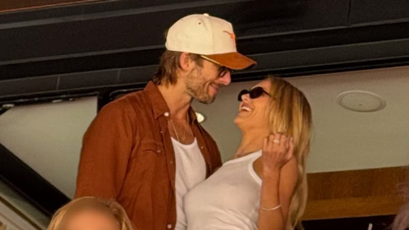 Glen Powell Cheers On Longhorns with Michelle