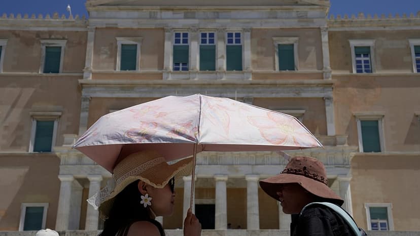 Europe Heatwaves: Tourists Embrace Hats Amidst Fire Fears