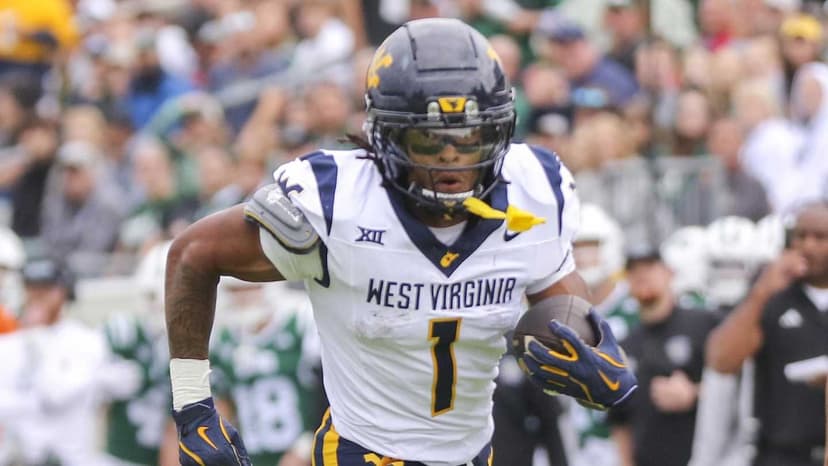 WVU Running Back White Lands with Mean Green