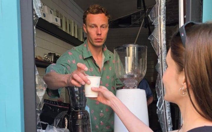 Kyiv Café Reopens Amid Rubble, Symbolizing Resilience