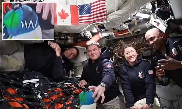 Flickering text on plush toy sparks NASA Artemis II hoax claims.