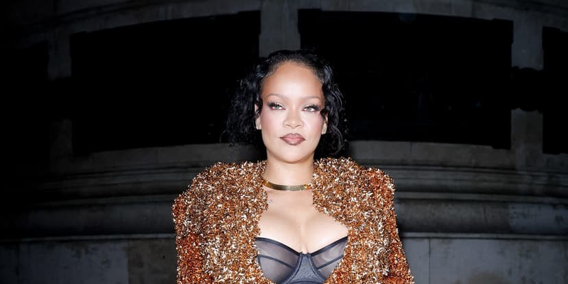 Rihanna Dazzles in Gold Tinsel at Paris Fashion Week