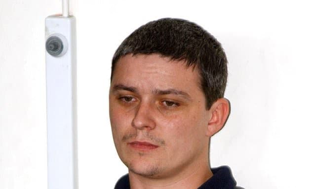 Caretaker's Chilling Stare: A Murderer's Mask