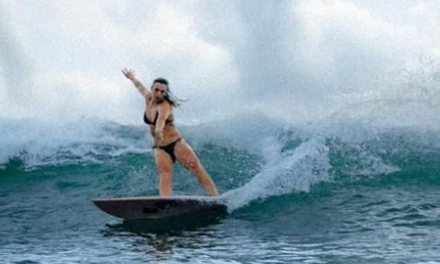Woman Surfer Tackles Record-Breaking Wave
