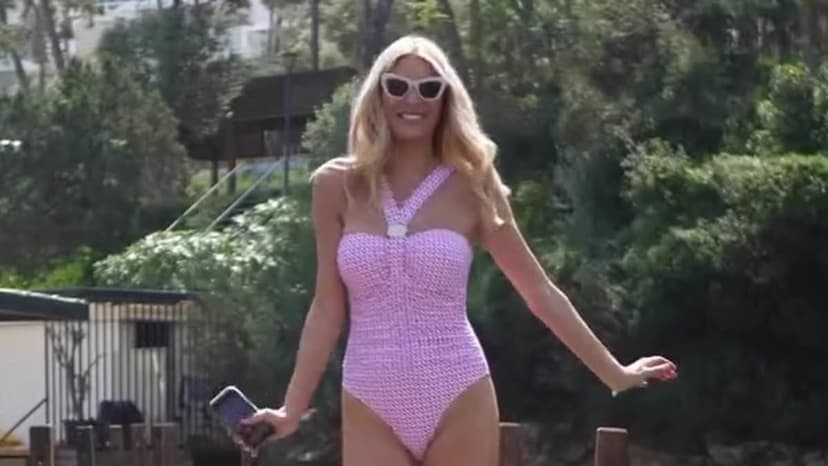 Tess Daly Stuns in Pink Swimsuit for Naia Beach Launch